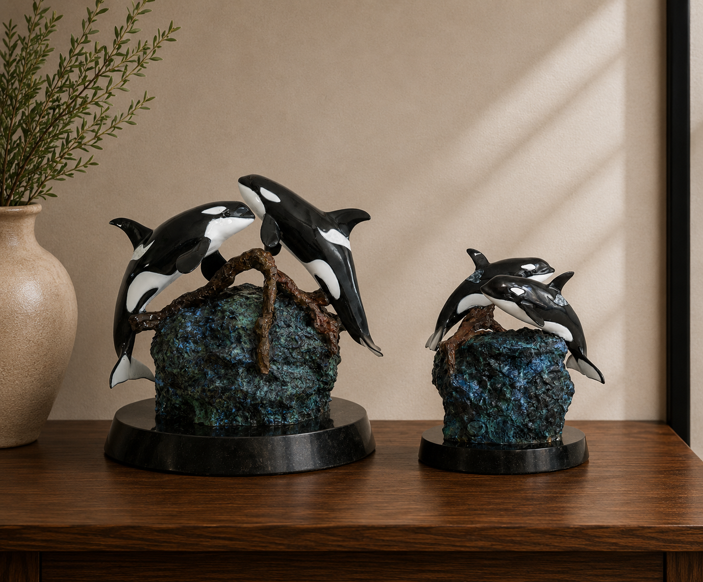 Devotion — two Wyland bronze orca memorial sculpture urns in full-size and keepsake